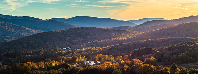 Landscape view of Vermont with fall colors and small village