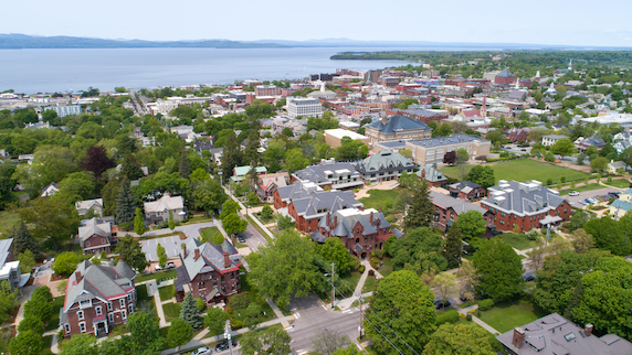 An aerial view of Champlain College with the shoreline in the distance