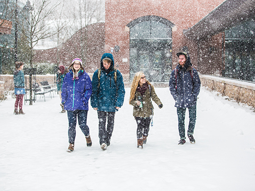 Students walking on campus in the snow
