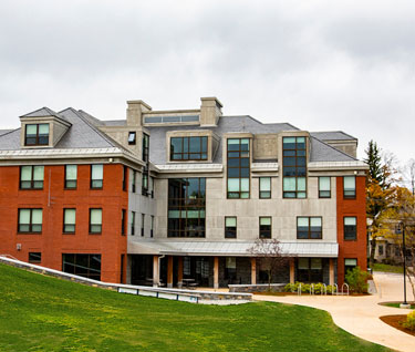 View across Finney Quad to Valcour Hall, a contemporary residence hall.