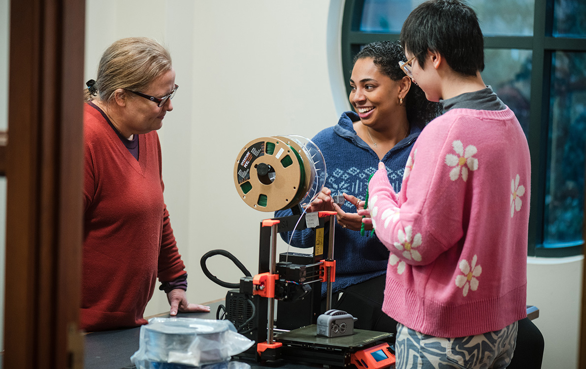 students receive instruction regarding the 3D printer