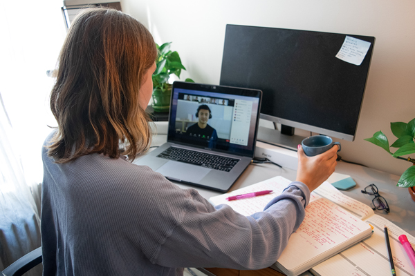 Student collaborating remotely in a video meeting