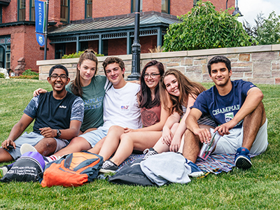 group of diverse students on the lawn