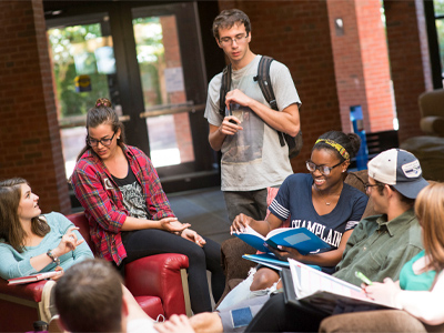 group of diverse students gather to study