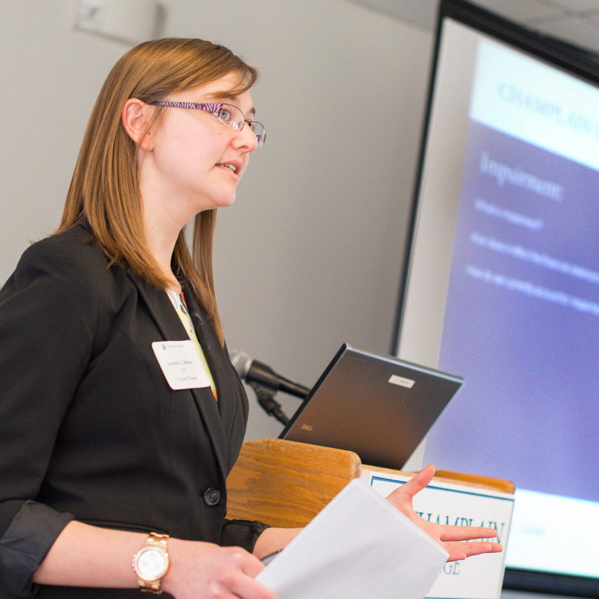 student presents slide show to audience