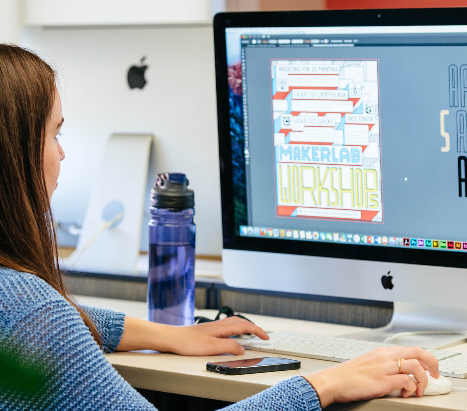 student layouts out a design on the computer