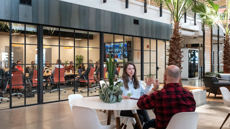interior of a building where various groups of people are meeting