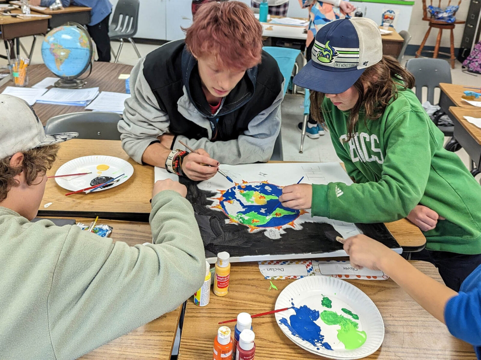 younger students doing an art project