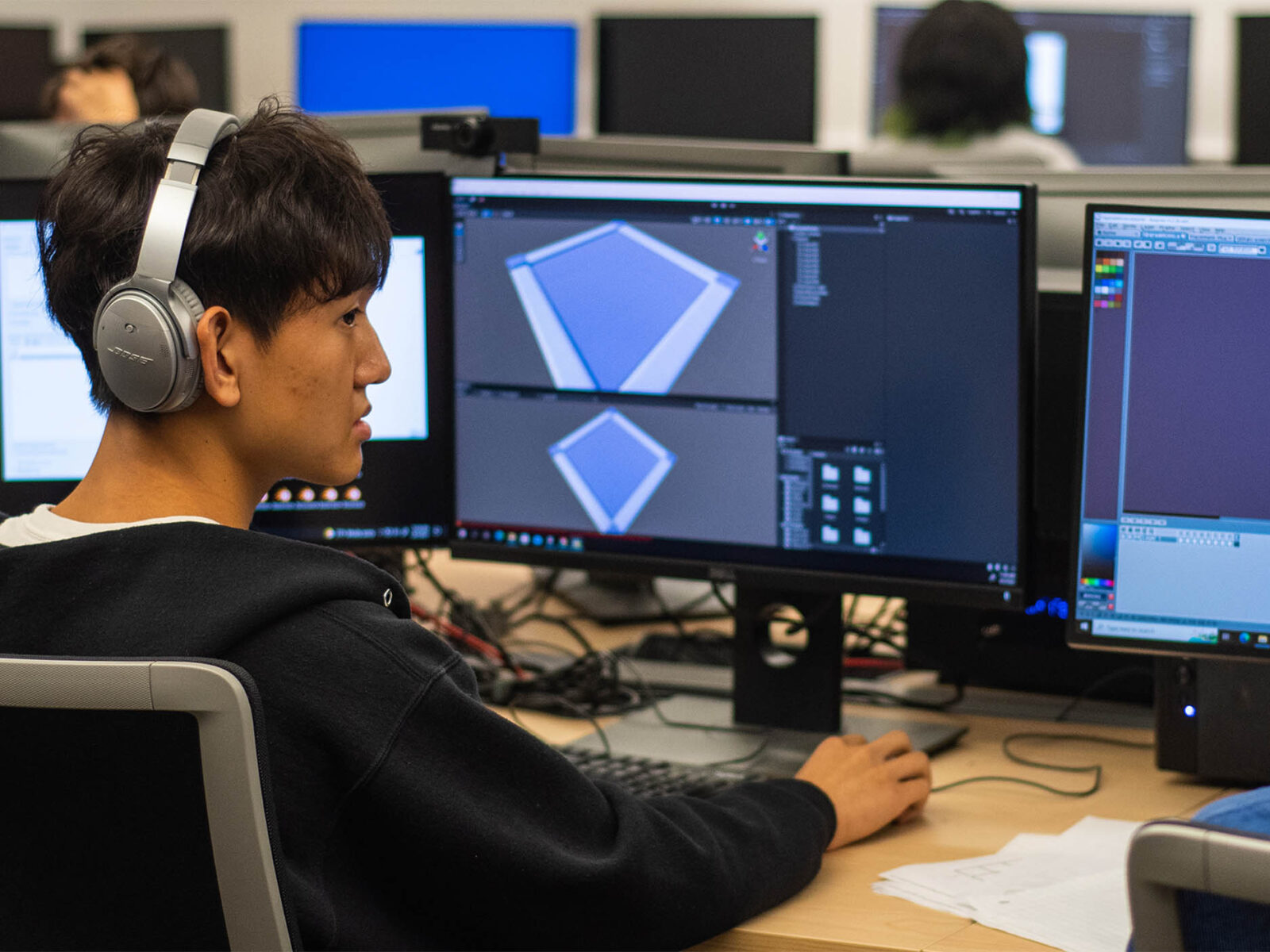 game design student working on a computer