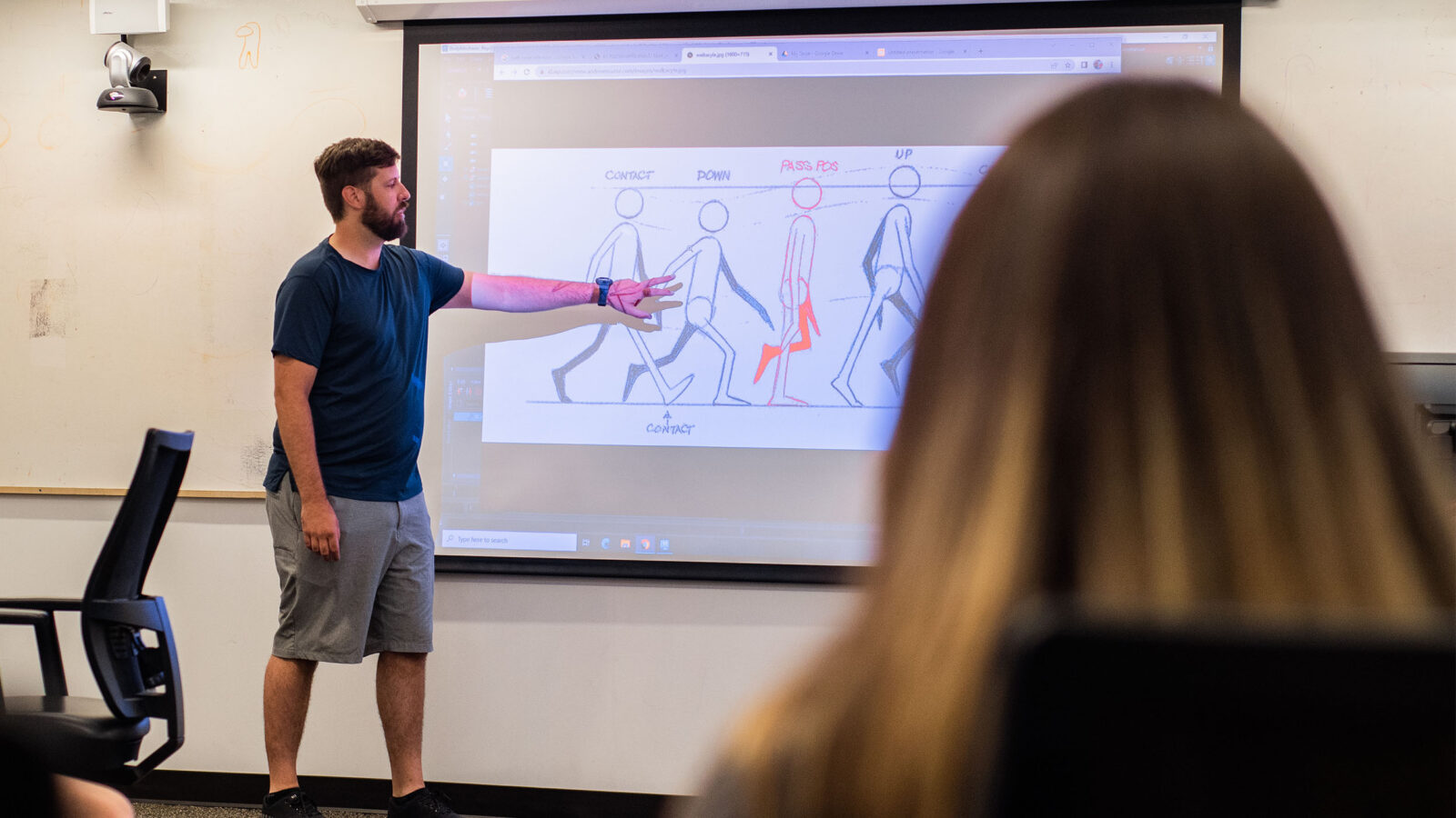 professor instructing students how to animate a walk cycle