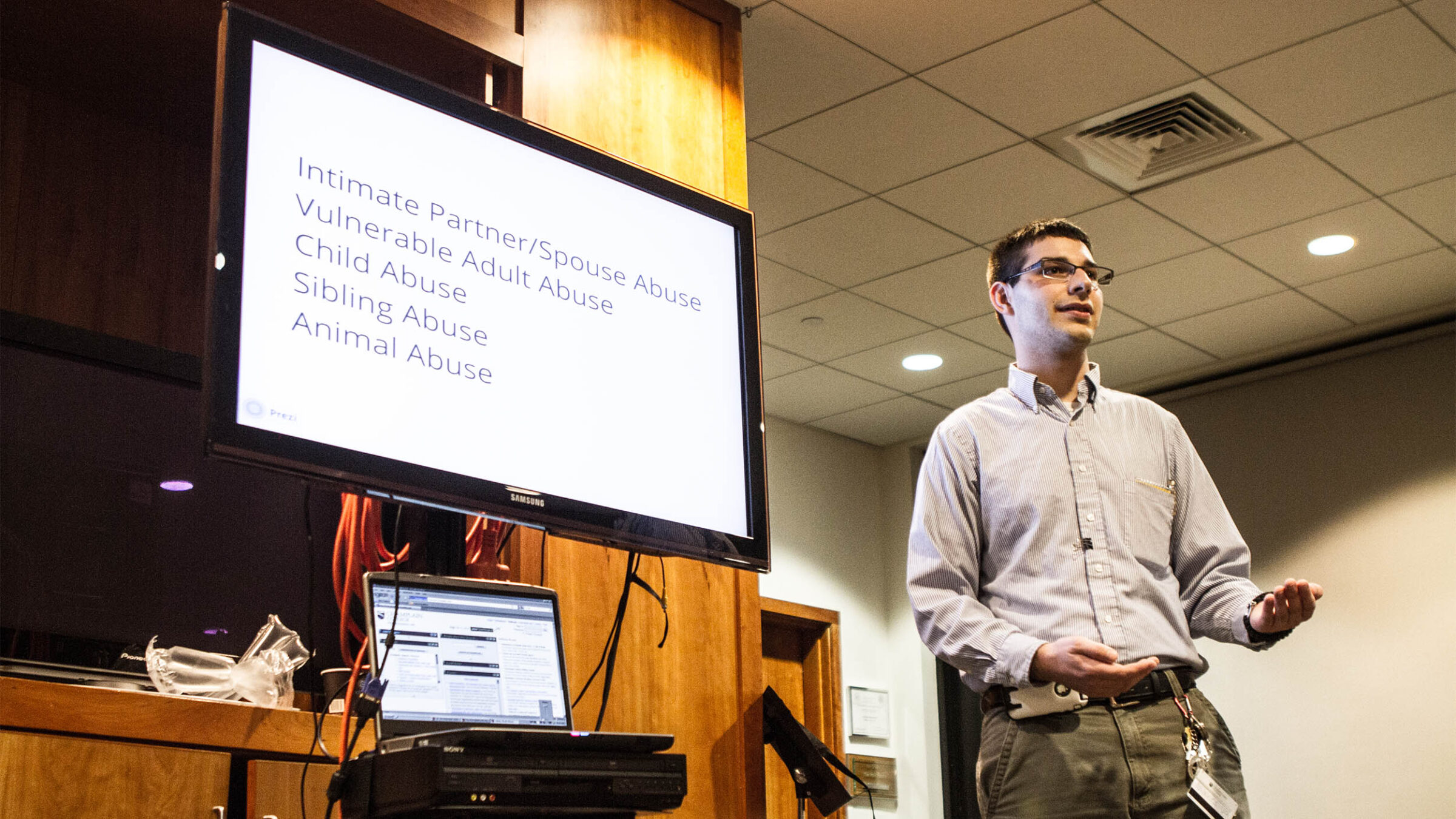 student delivers a presentation in a professional environment