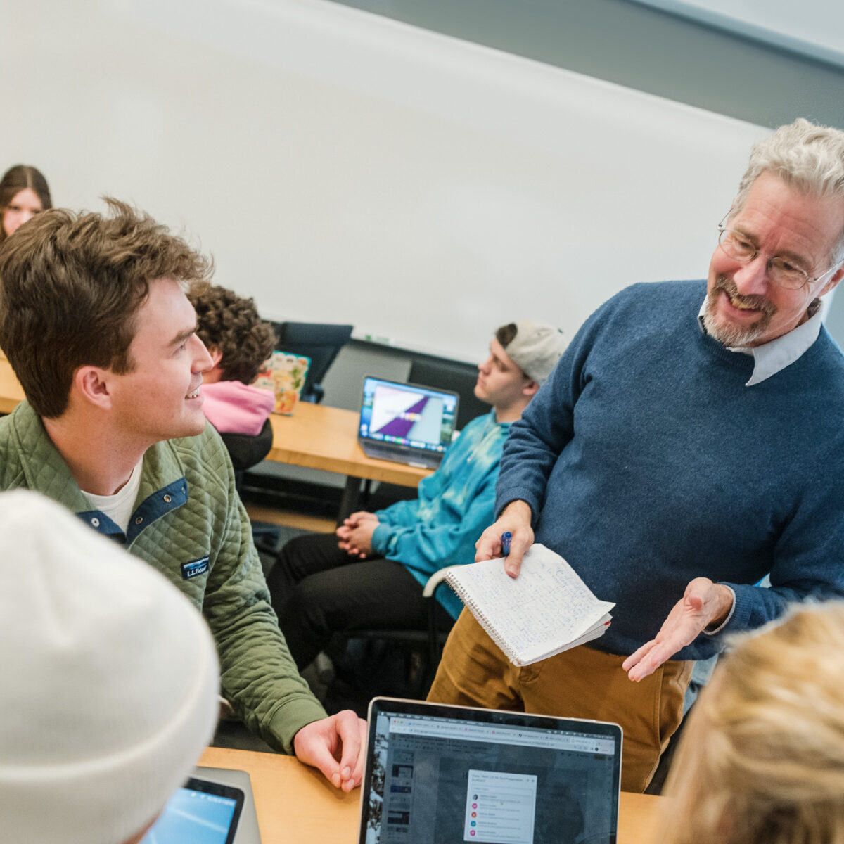 professor speaks to a group of seated students