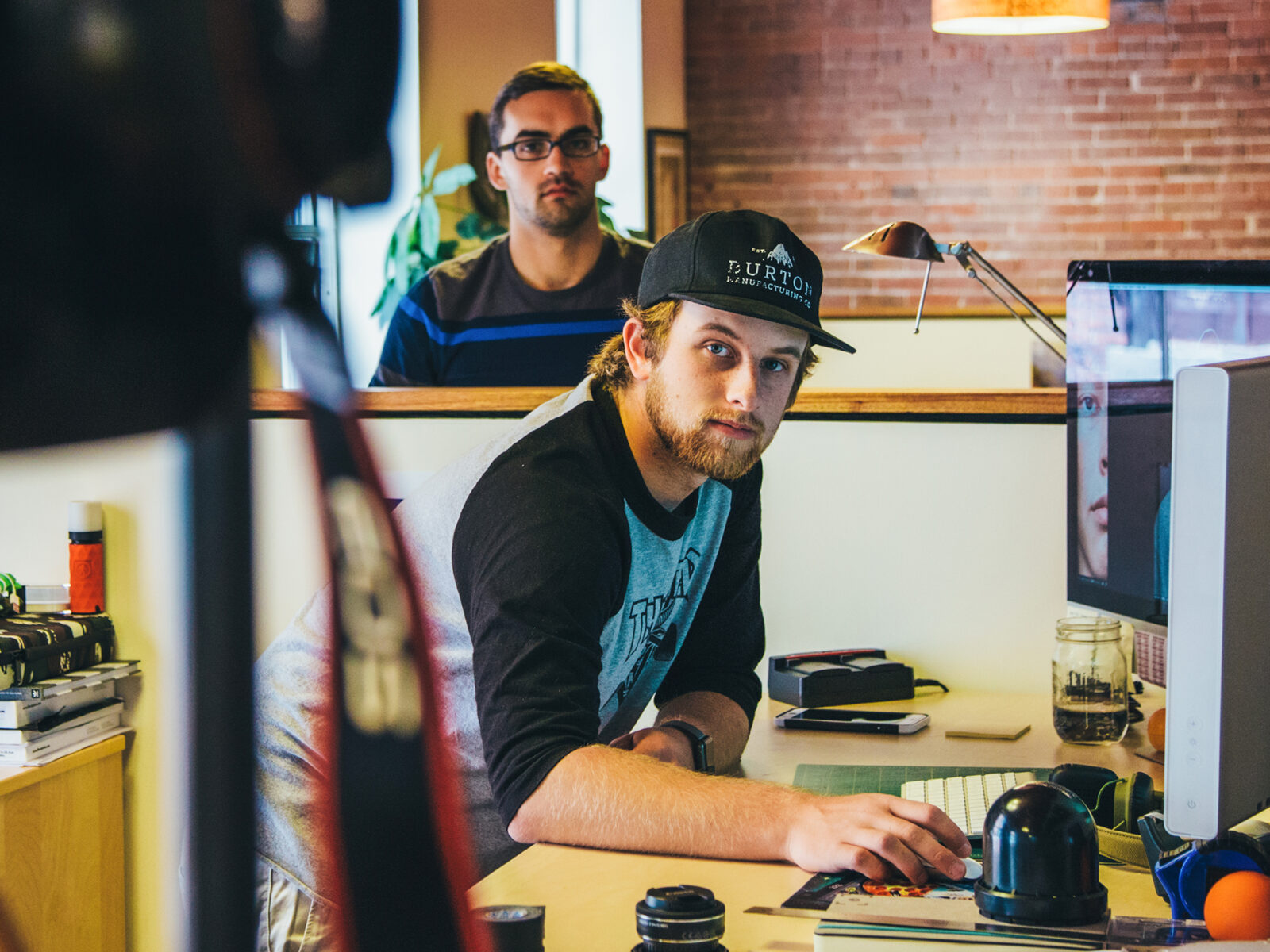 graphics design student at internship with Burton Snowboards