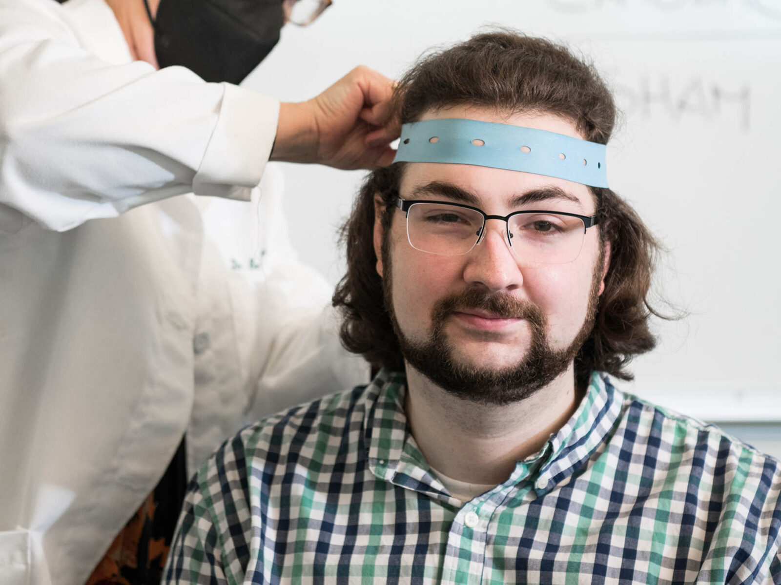 psychology student aids in psychological testing for an experiment