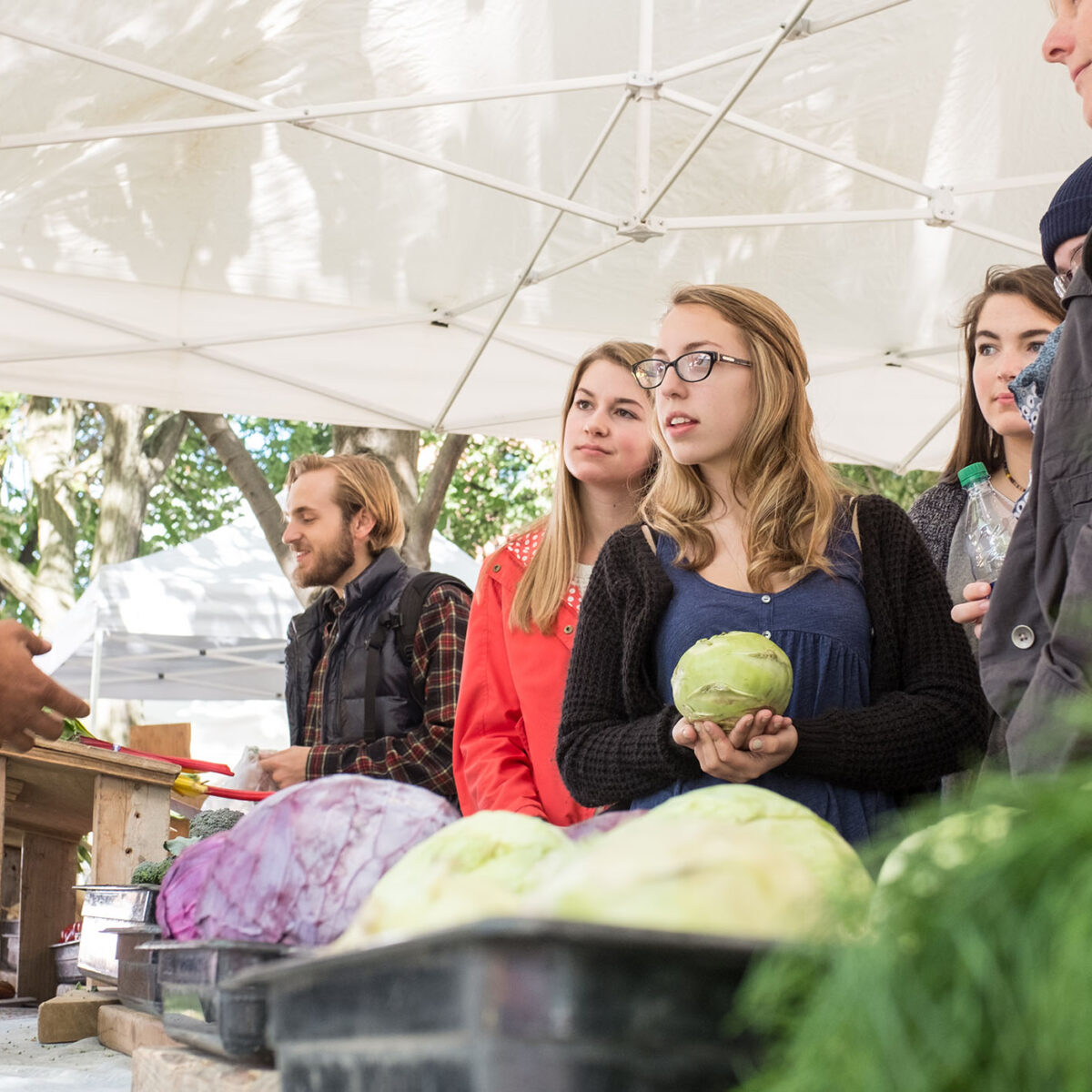 applied sustainability students at a local farmers market