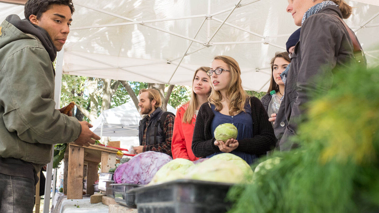 applied sustainability students at a local farmers market
