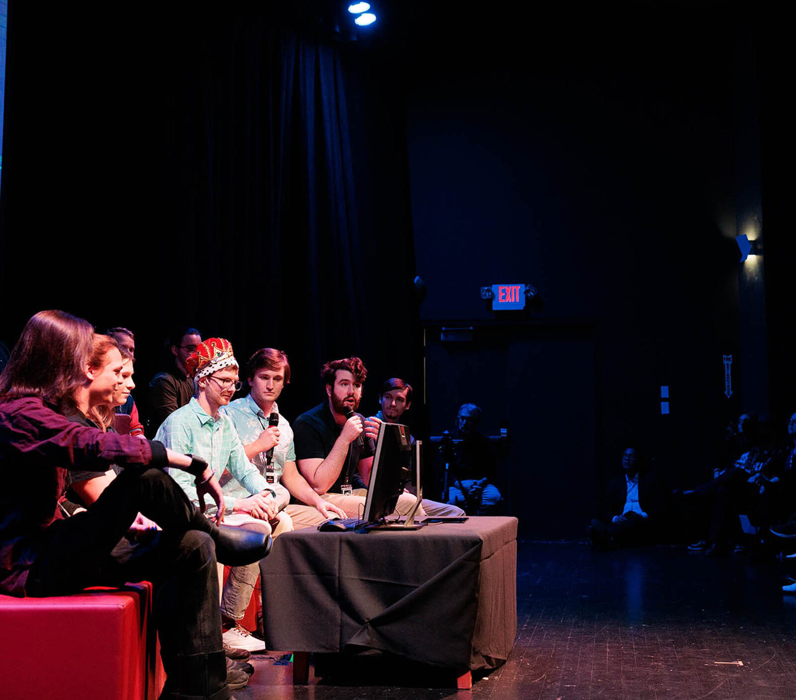 a group of game studio students unveiling their new game at the senior game show