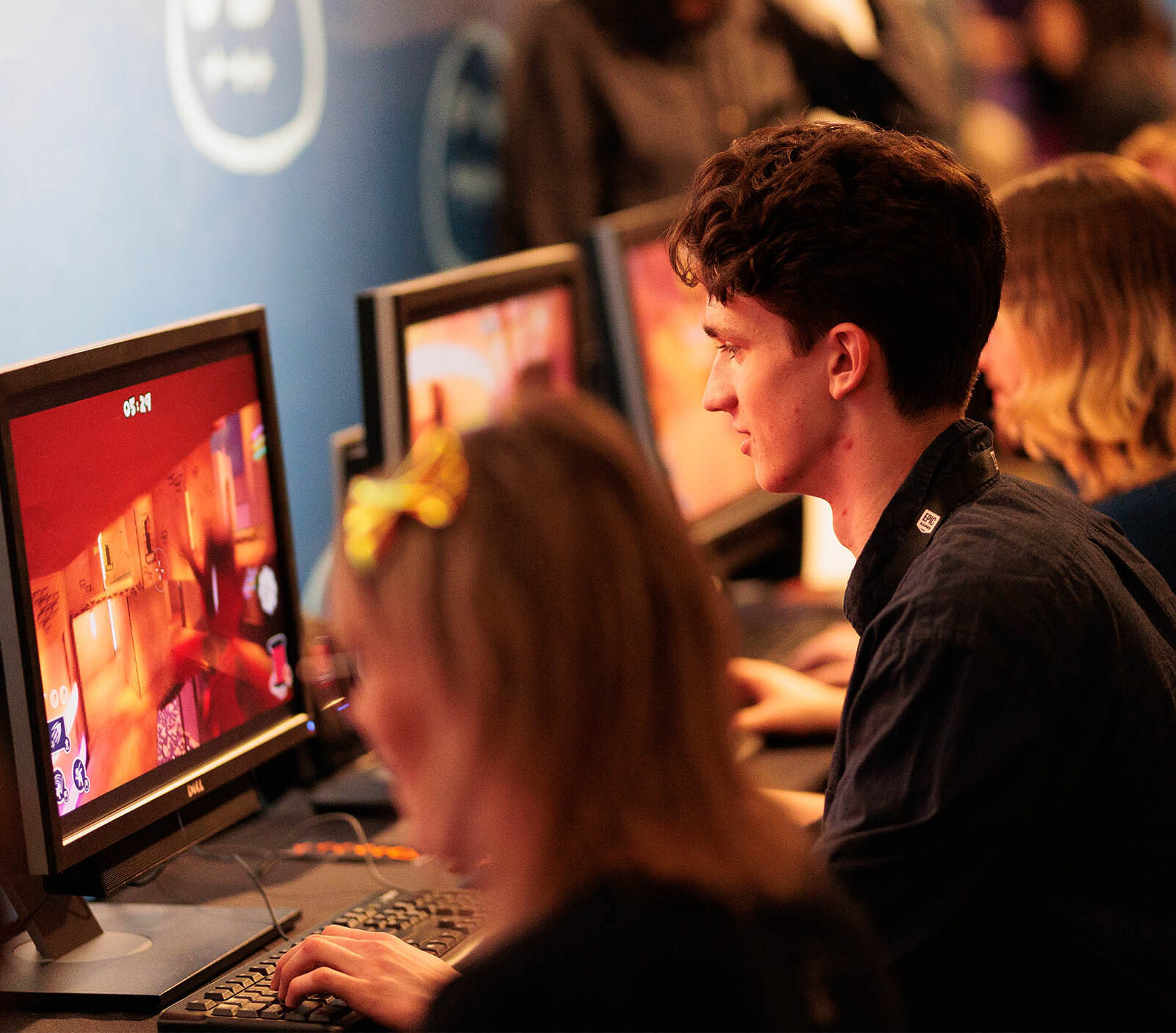 a group of individuals testing out the student games from the 2023 senior game show