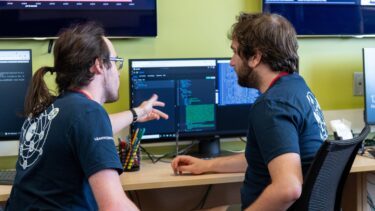 Two students working on a computer