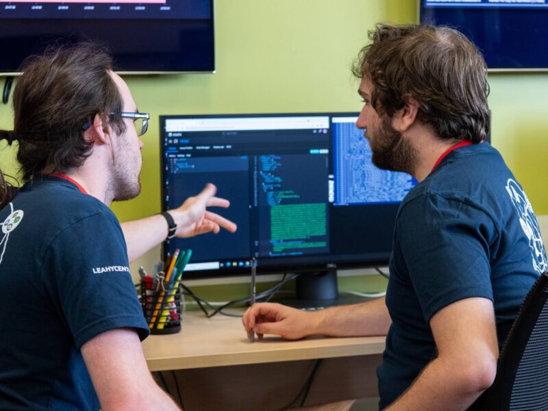 Two students working on a computer