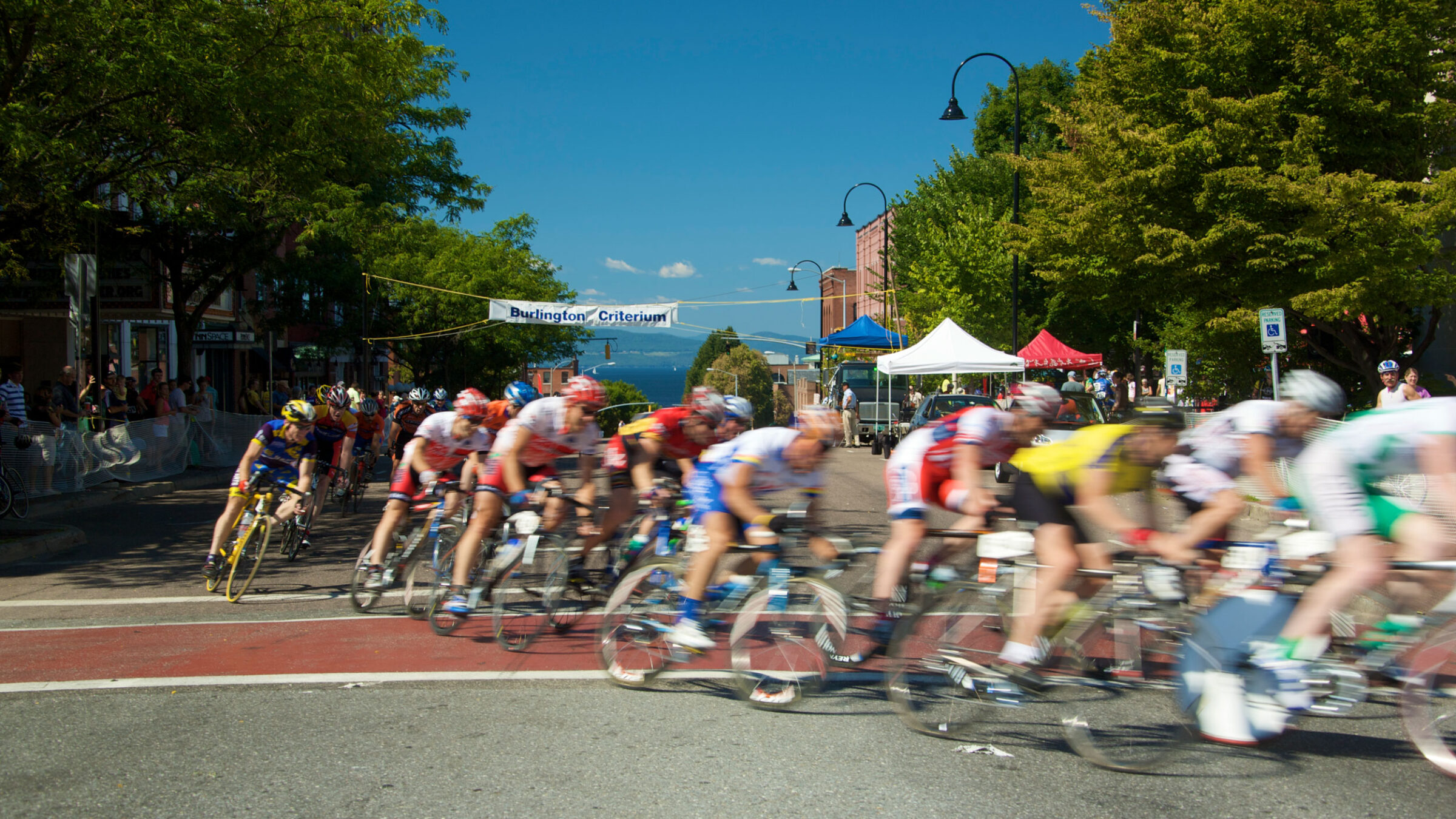 A bike race rounds a corner of downtown Burlington