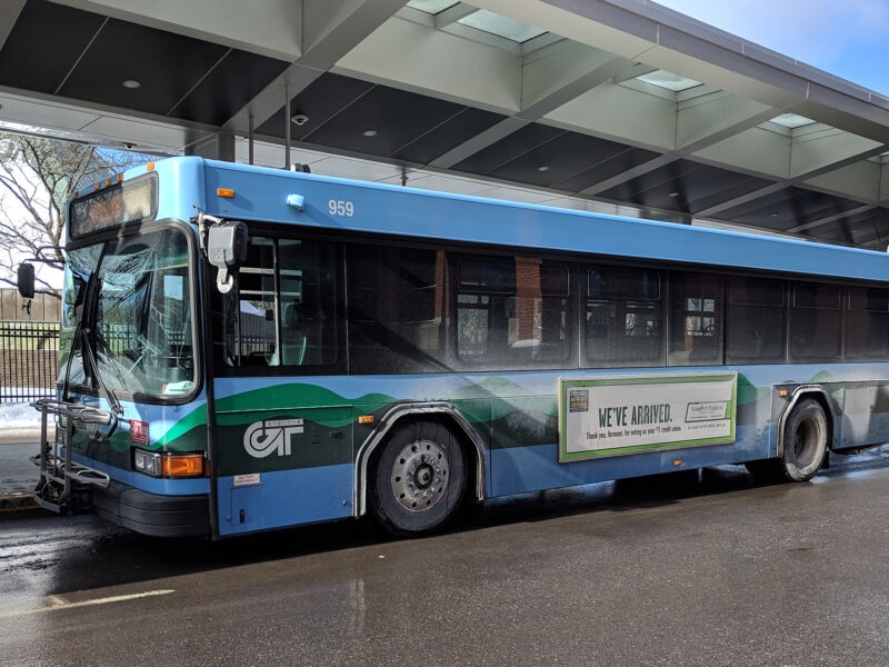 a green mountain transit bus parked at the burlington bus station