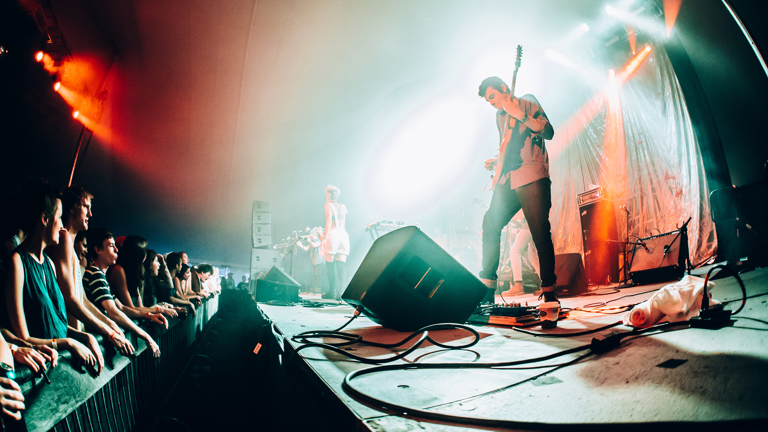 Crowd gathers to listen to a band on Church Street during Jazz Fest.