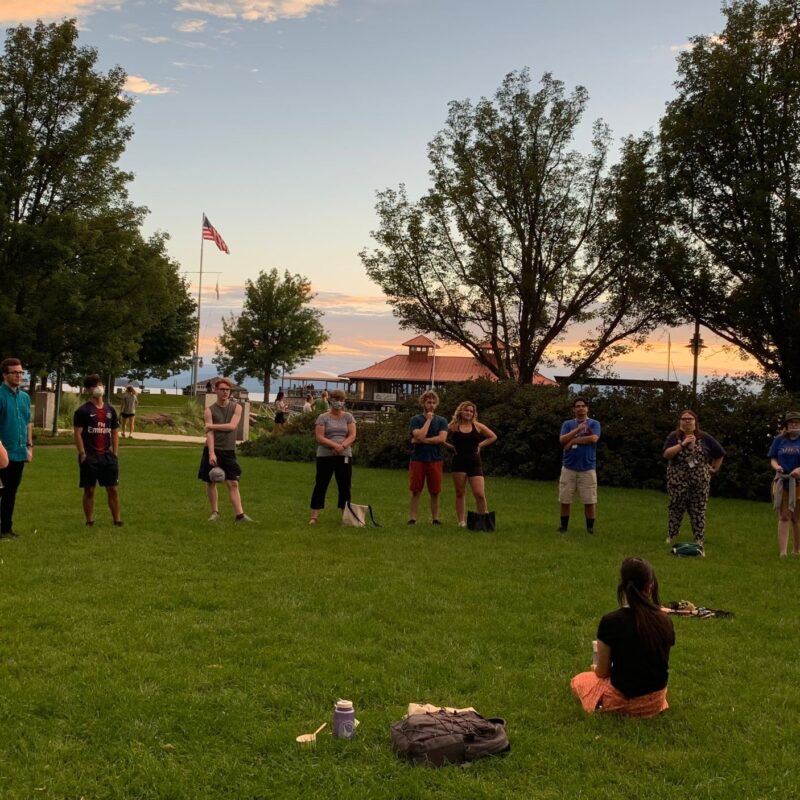 AHEAD Program students in a field near lake Champlain