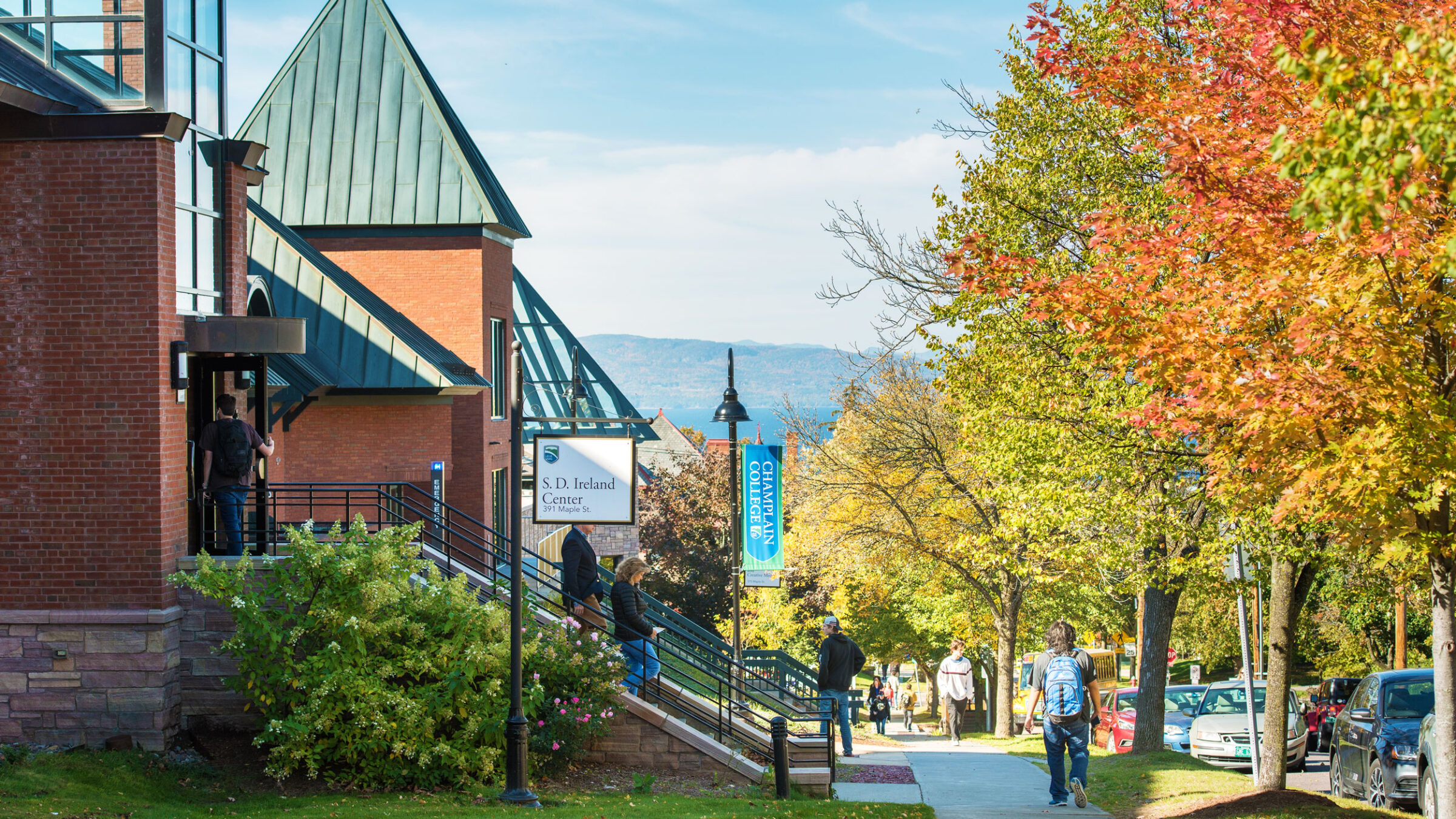 Champlain campus buildings along Maple Street in the fall