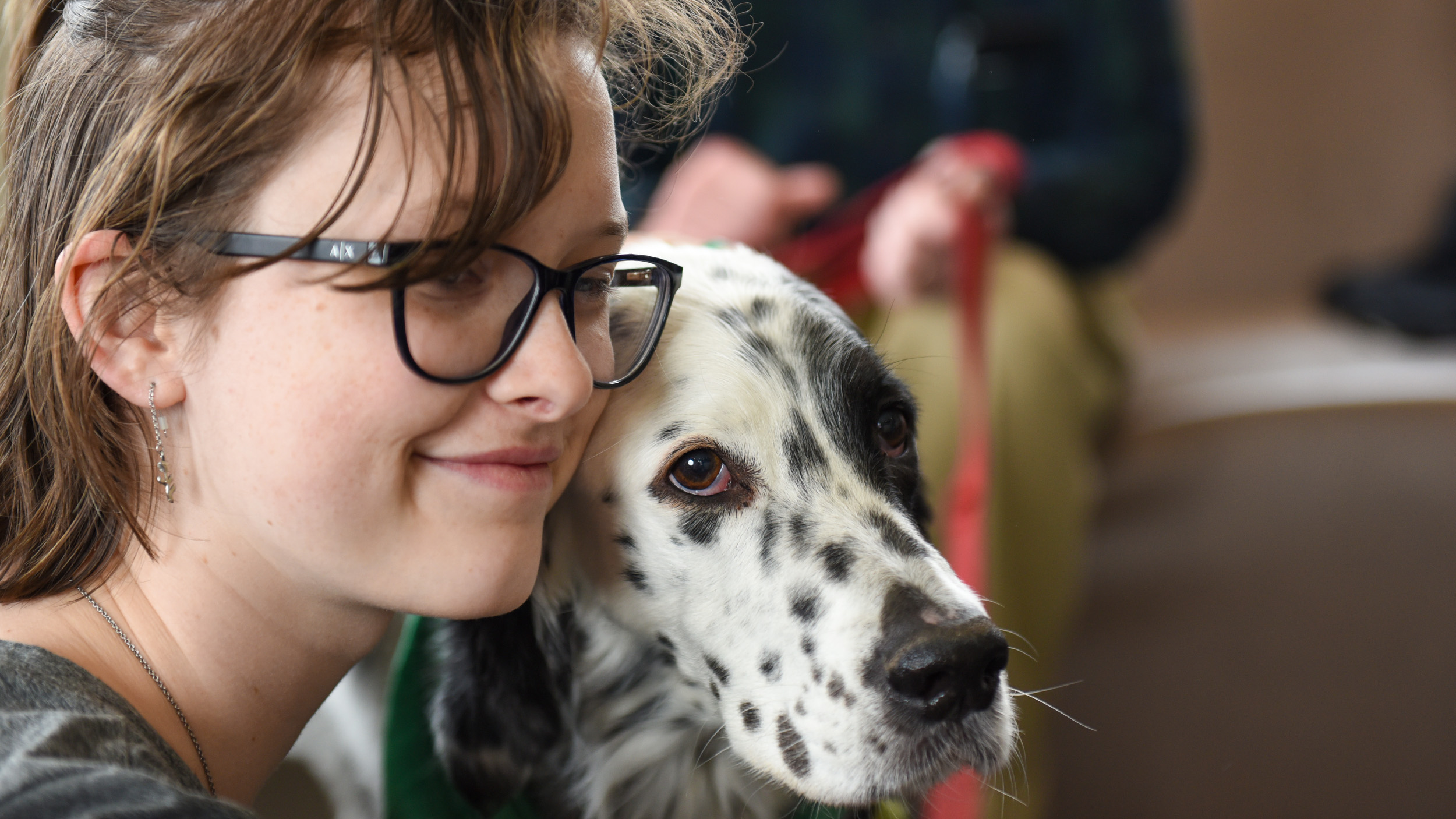 student enjoys times with a therapy dog