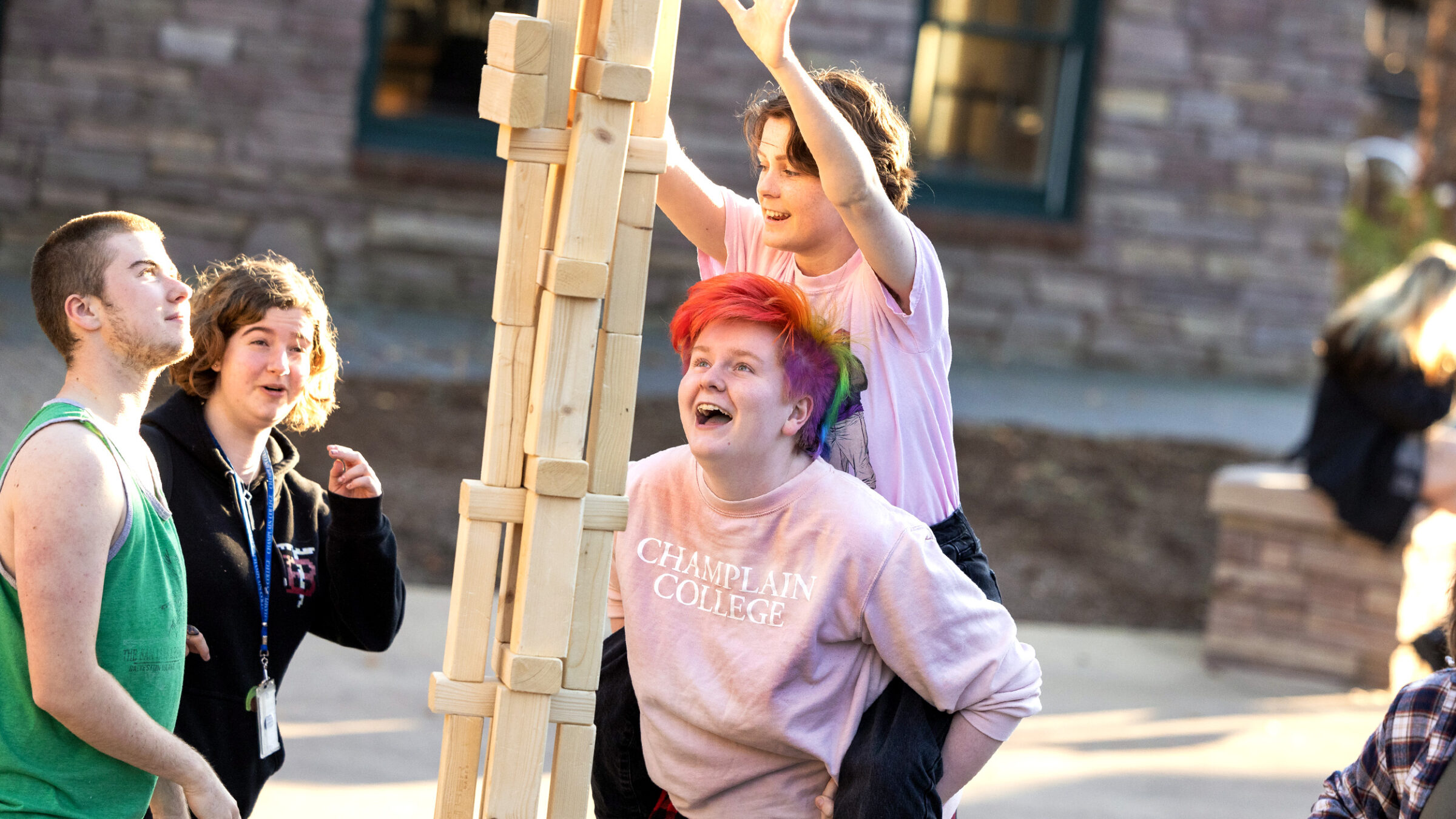 students play a games of oversized jenga
