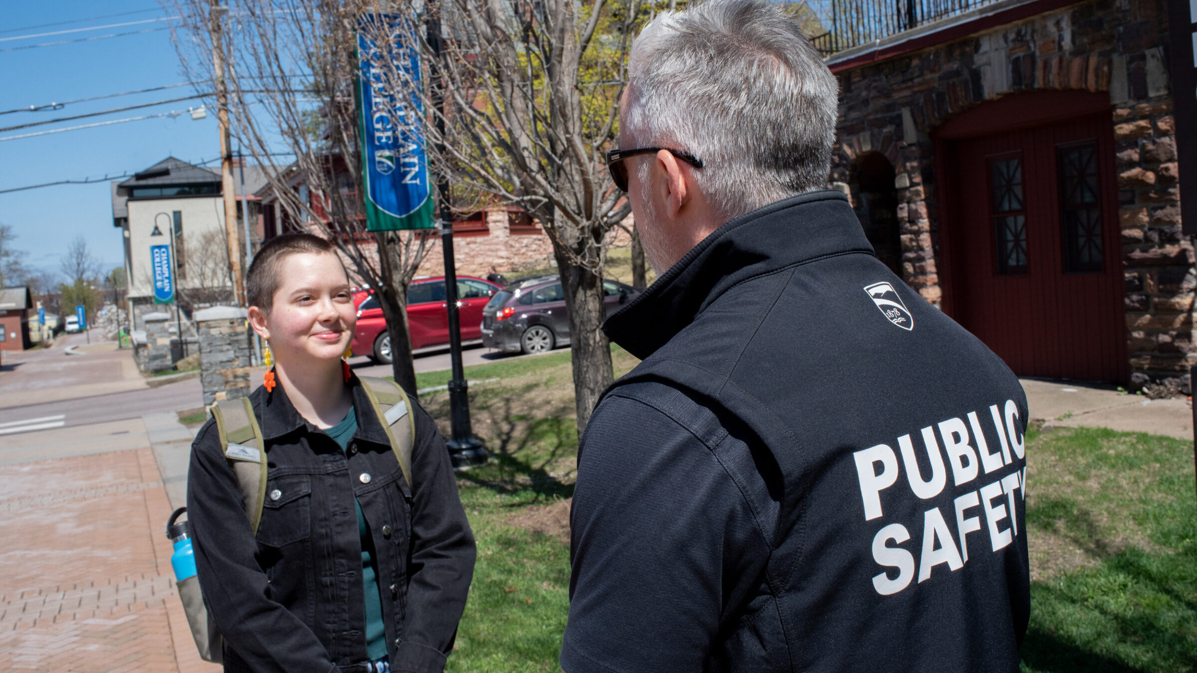 student talks casually to campus safety officer