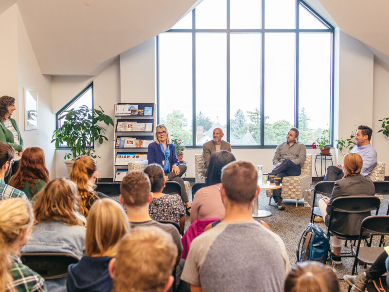 four event speakers talk to students in the ccm building