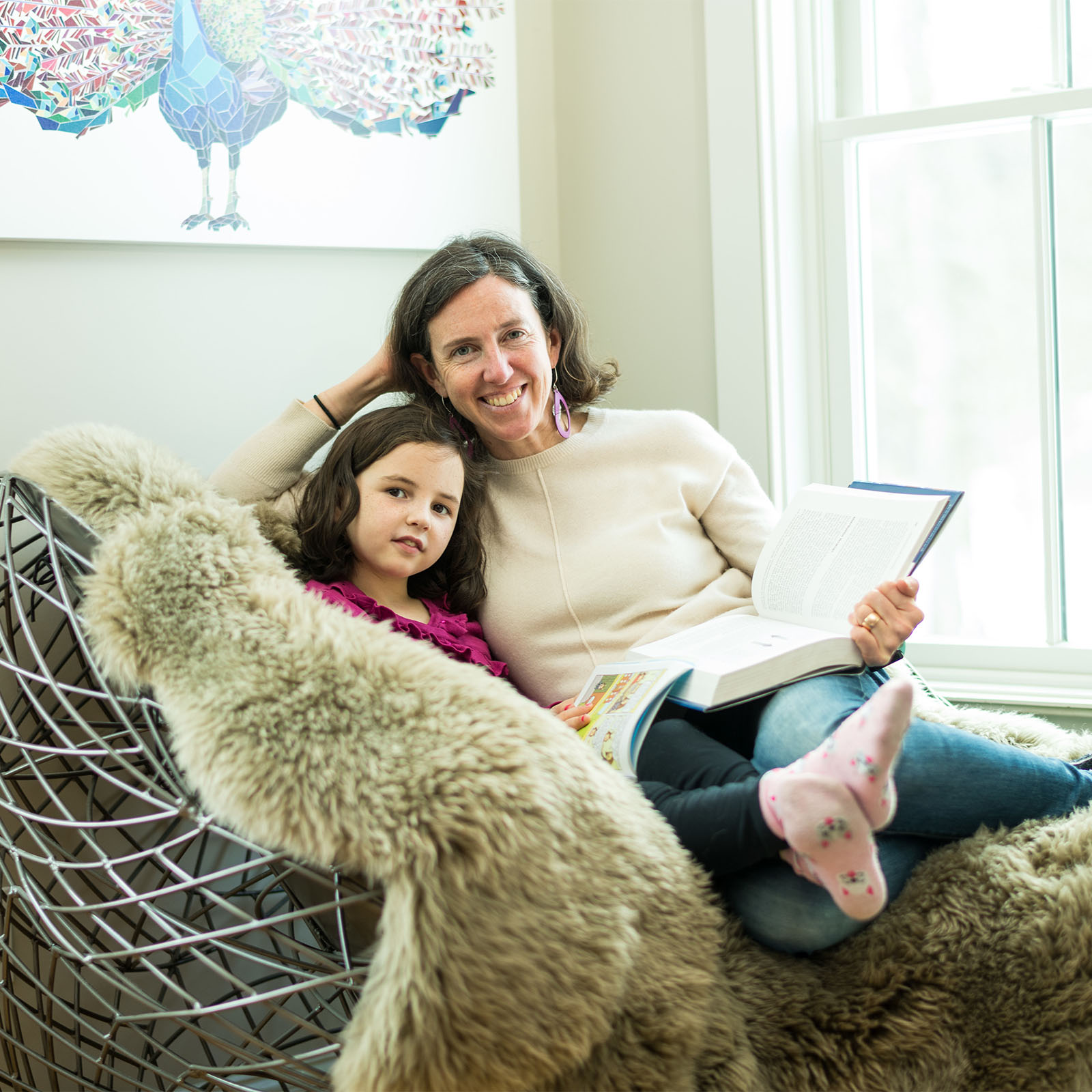 mother and daughter reading books together