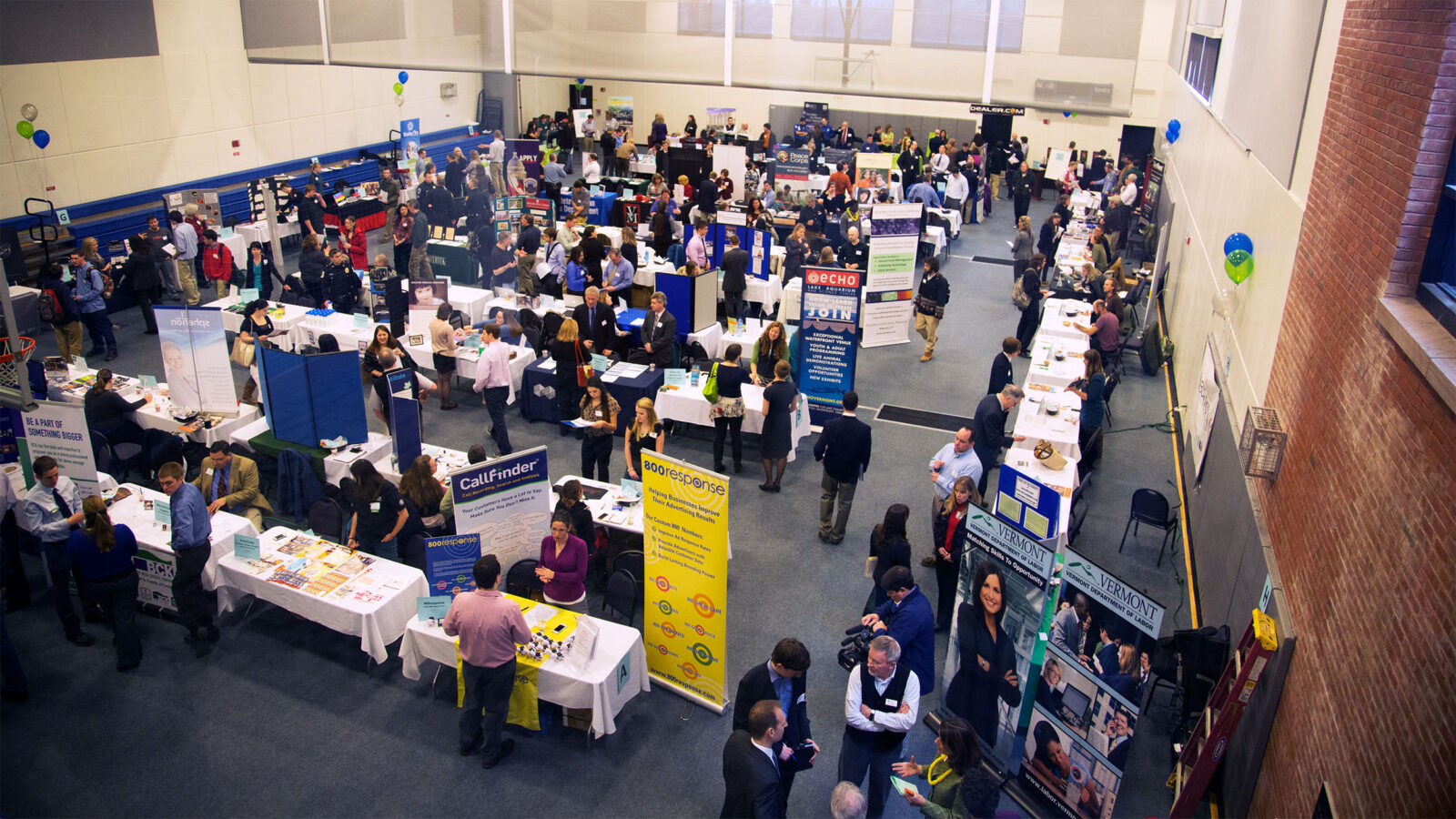 student attendees crowd the idx gymnasium for a career fair