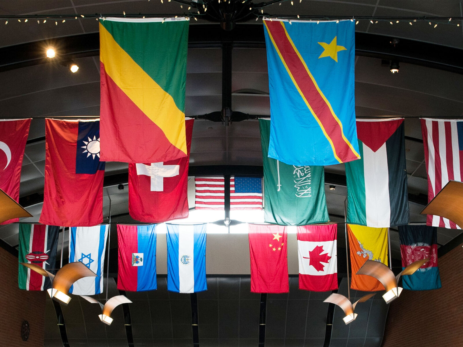 Flags from different countries hang from the ceiling in the IDX Dining Hall.