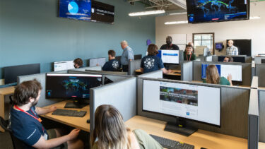 cybersecurity & digital forensics students collaborating in the leahy center