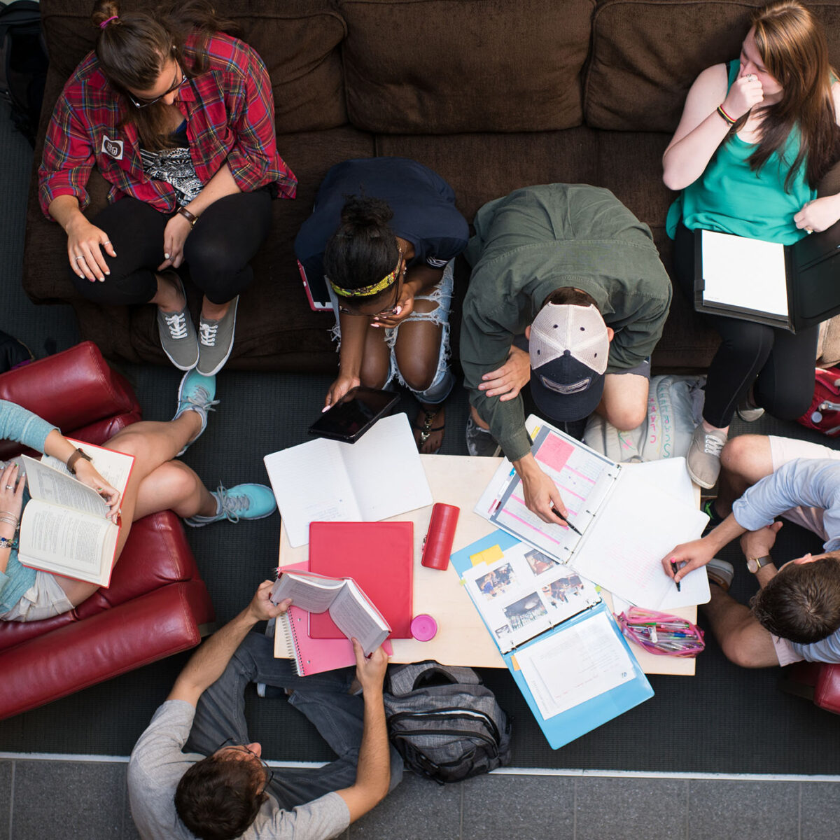 a group of students sitting on couches for a collaborative study session