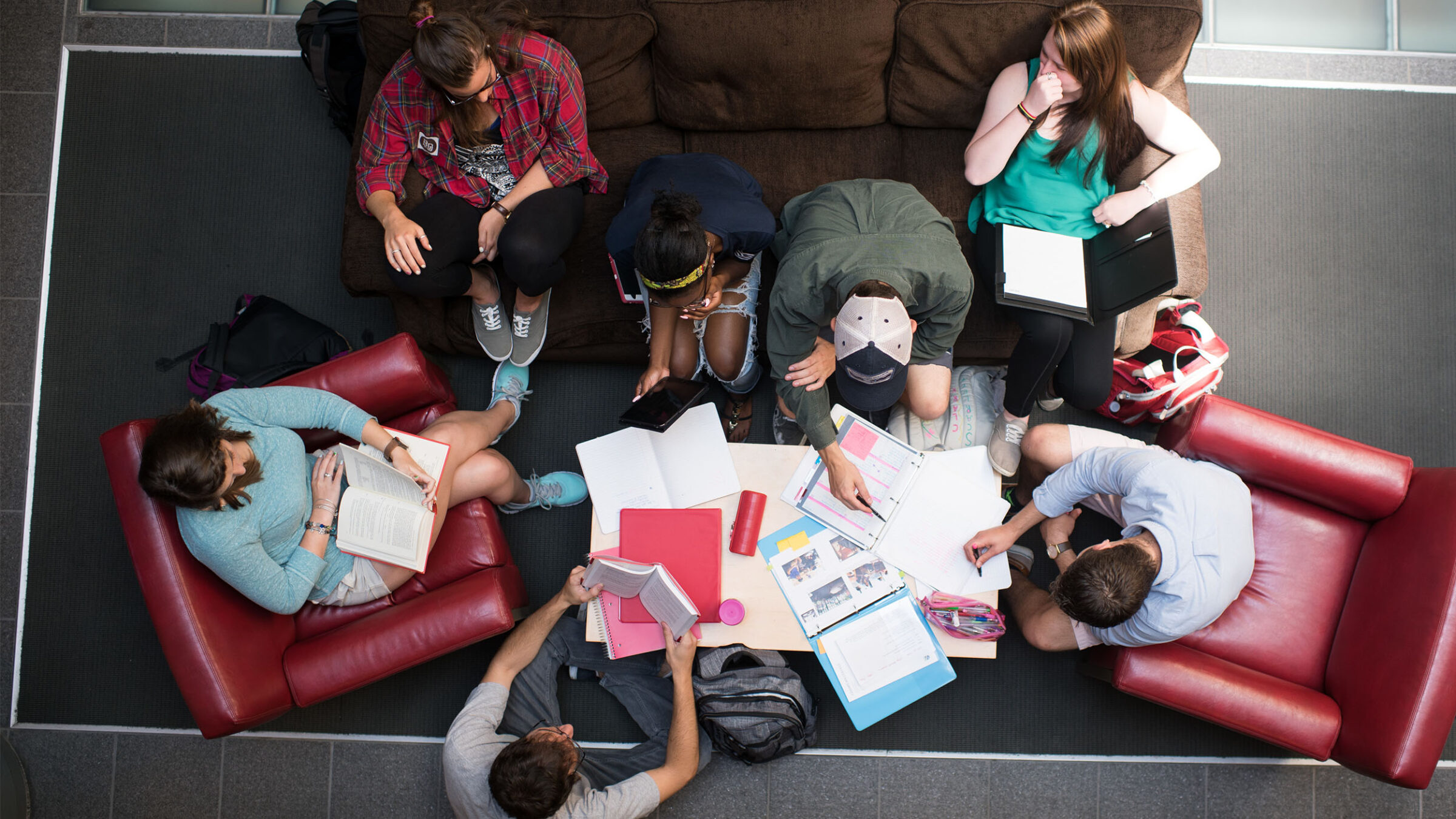 a group of students sitting on couches for a collaborative study session