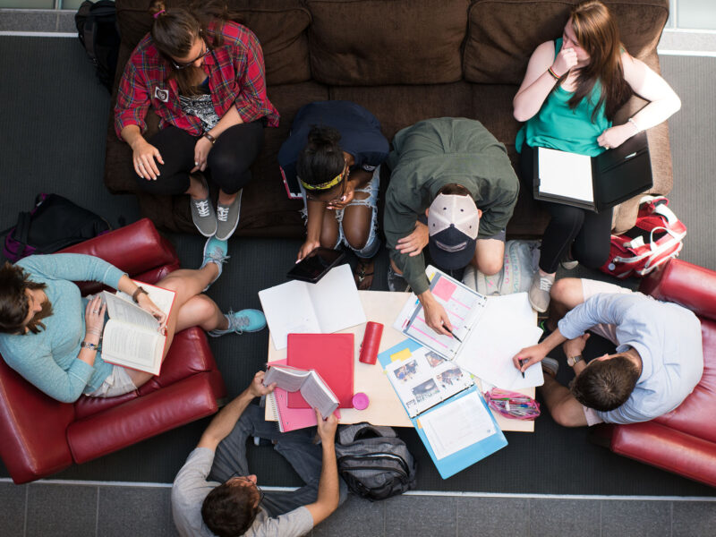 a group of students sitting on couches for a collaborative study session