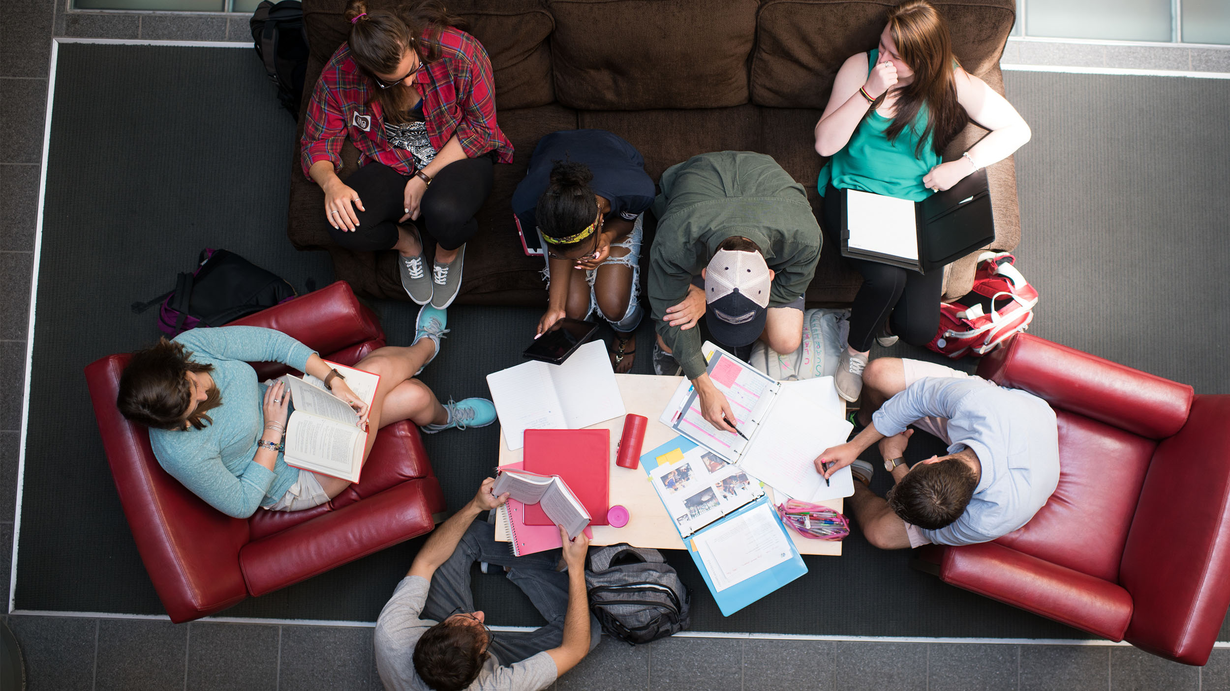a group of students sitting on couches for a collaborative study session