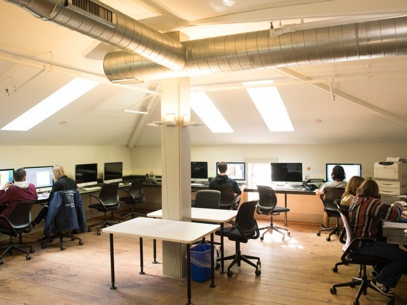 interior shot of the metz studio barn computer lab with students working on mac computers
