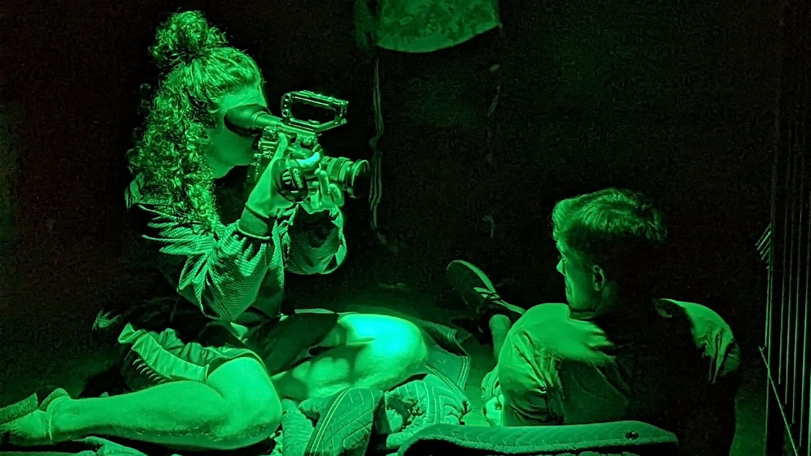 Montreal filmmaking students in the darkness and green led lights