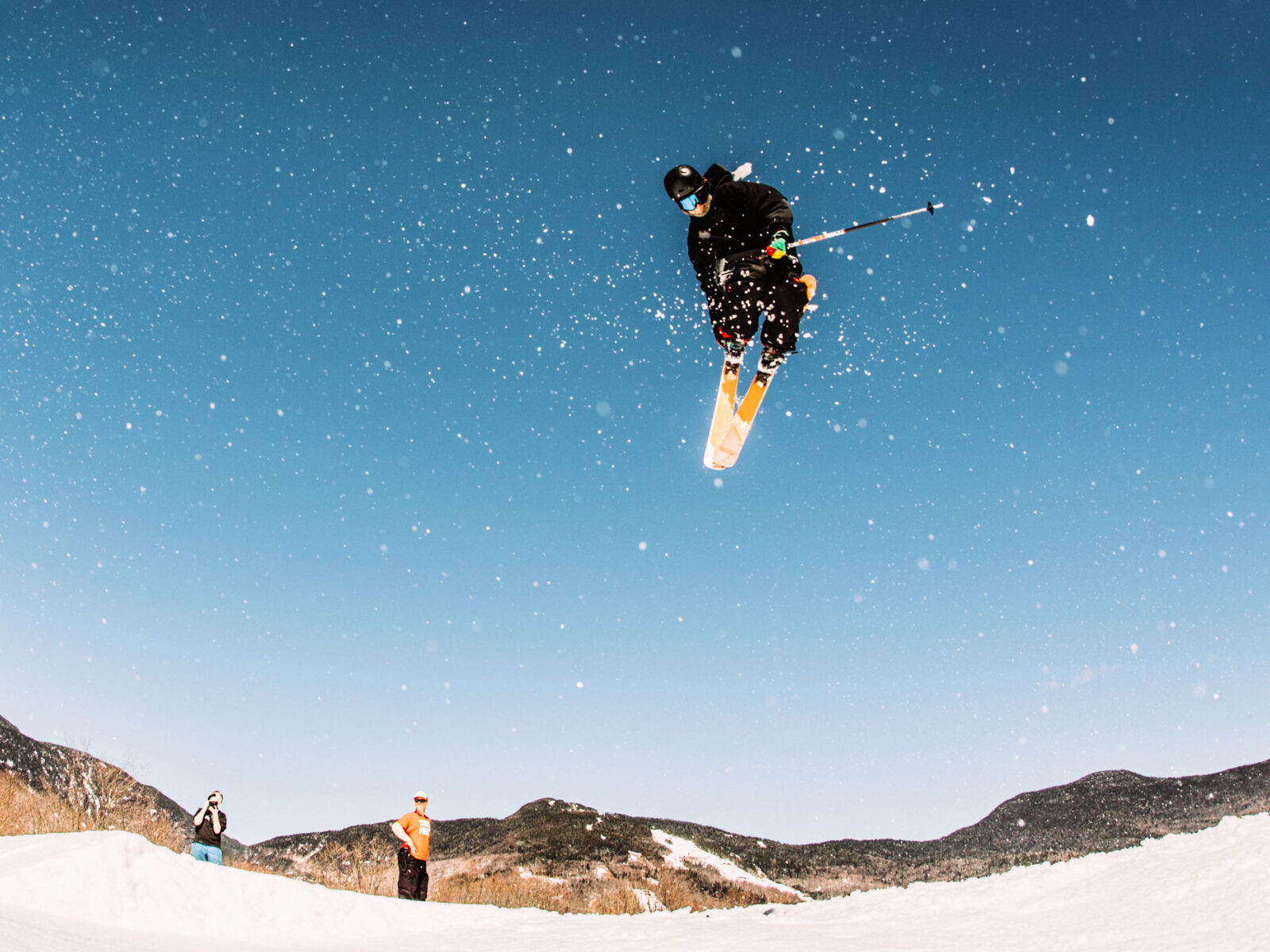 A skier mid-air after catching a jump.