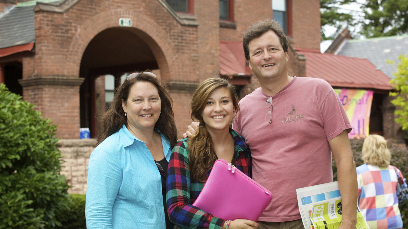 family poses for a photo during orientation