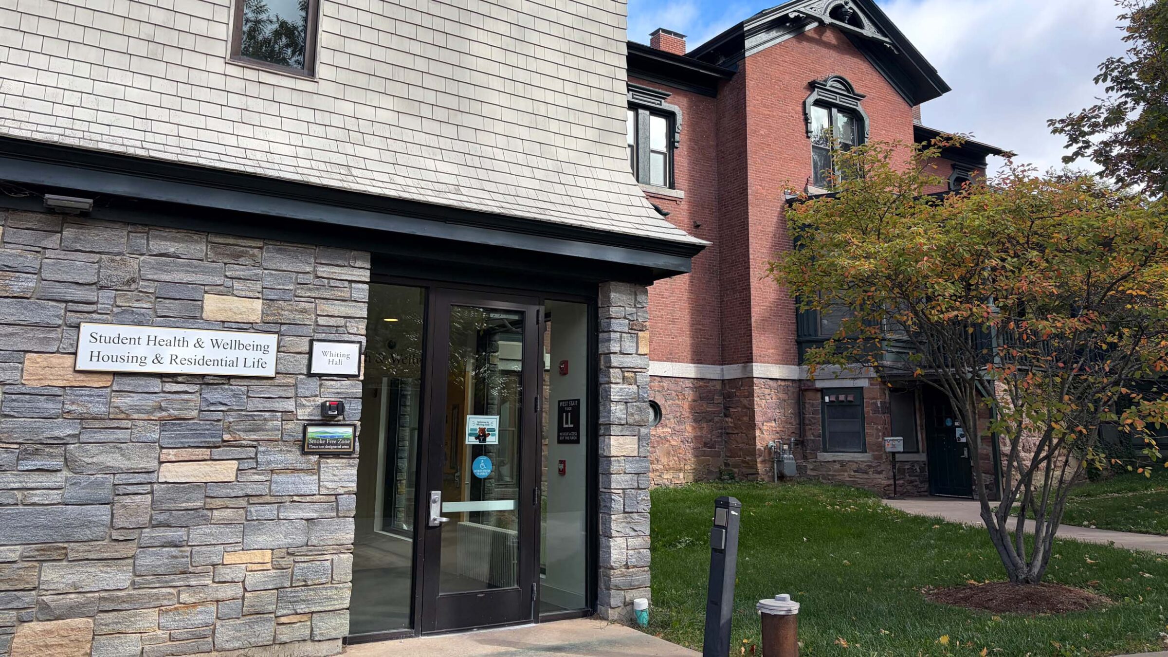 Whiting Hall's Student Health Center entrance during a cloudy day.