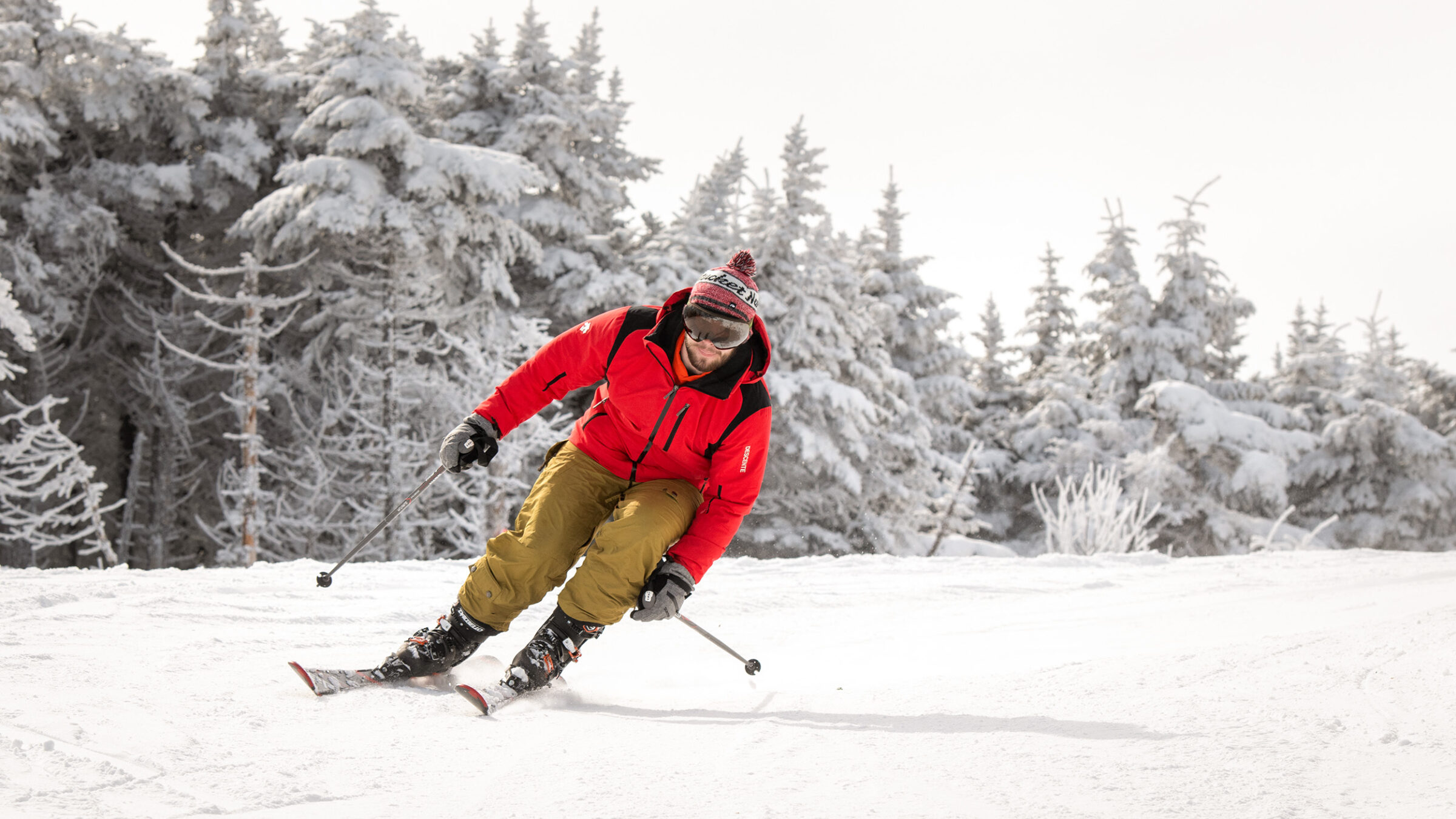 skier in bright clothing surrounded by white snow