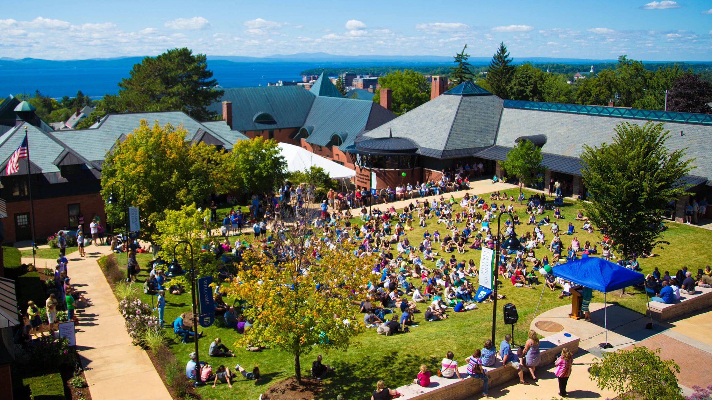 hundreds of students gather on the green for orientation