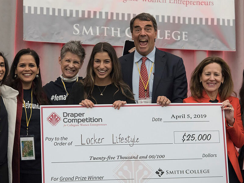students pose with a $25000 check at the 2020 draper competition for collegiate women entrepreneurs
