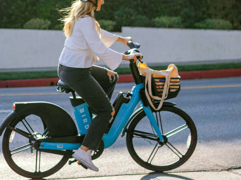 woman on a blue electric bike